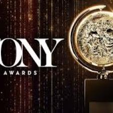 The words TONY Awards next to the actual TONY Award trophy.